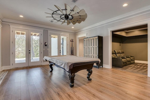 game room with pool table, french doors, light hardwood / wood-style floors, and ornamental molding