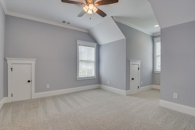 additional living space with ceiling fan, light carpet, and vaulted ceiling