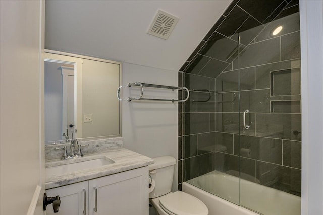 full bathroom with shower / bath combination with glass door, vanity, and toilet