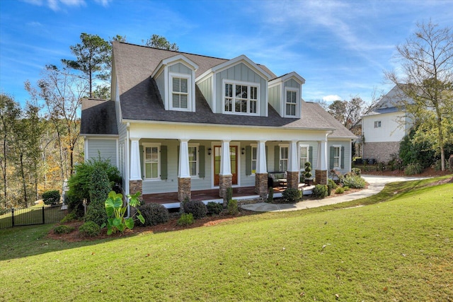 new england style home featuring a front yard