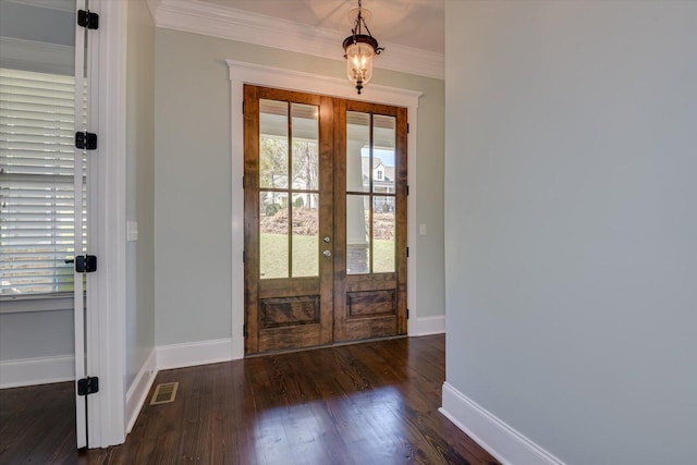 entryway with crown molding, french doors, and dark hardwood / wood-style floors