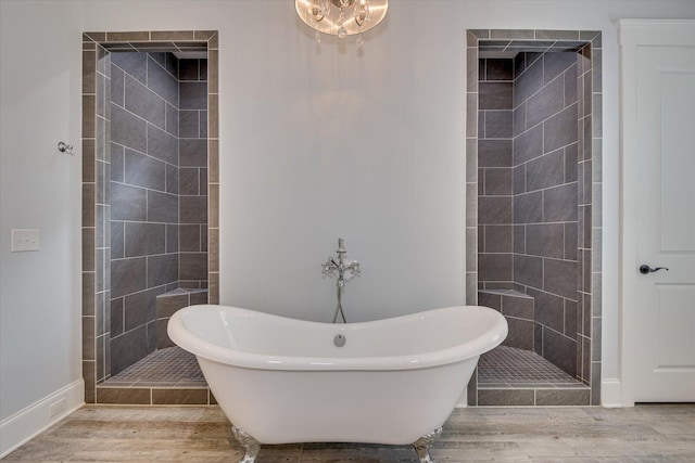 bathroom featuring hardwood / wood-style floors and independent shower and bath