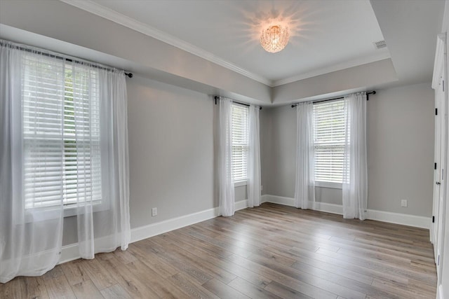 unfurnished room featuring crown molding and light hardwood / wood-style flooring