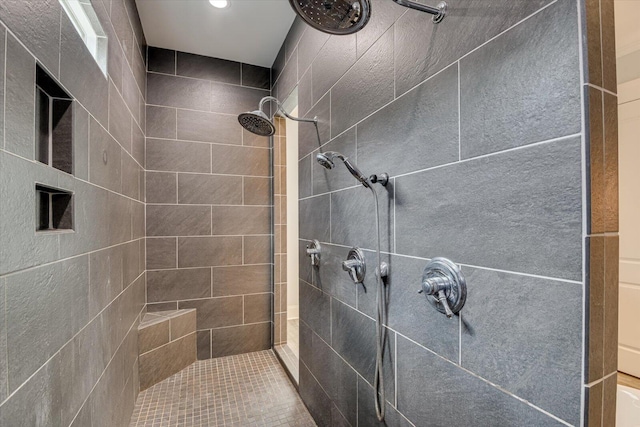 bathroom featuring a tile shower