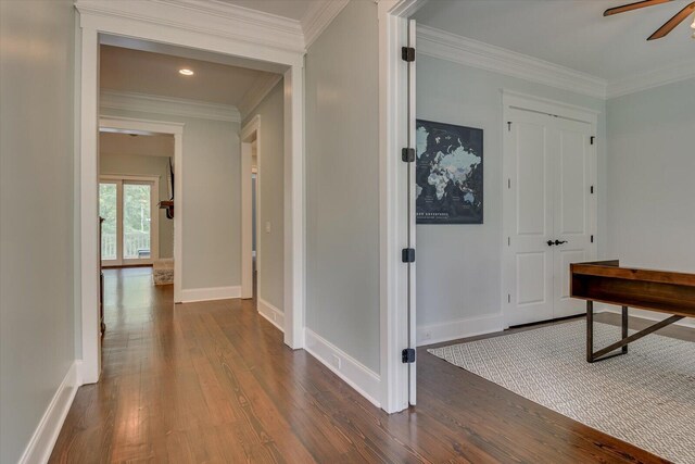 hall with crown molding and dark hardwood / wood-style floors