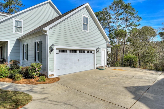 view of property exterior featuring a garage