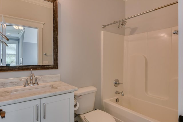 full bathroom with vanity, ornamental molding,  shower combination, and toilet