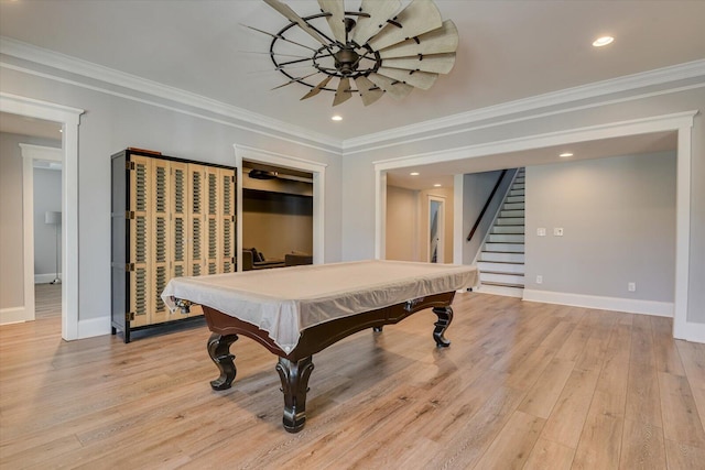 game room featuring light wood-type flooring, ornamental molding, and billiards