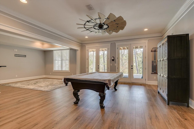 rec room featuring french doors, light hardwood / wood-style flooring, ornamental molding, and billiards