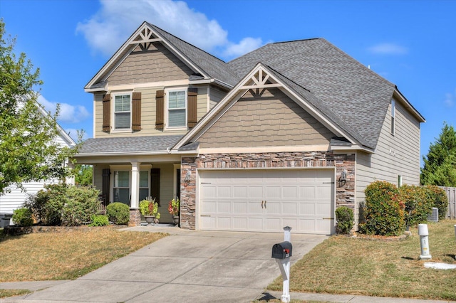 craftsman-style house featuring a garage and a front yard