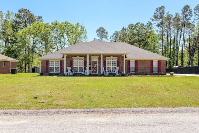 2795 Davis Mill Rd, Hephzibah, GA 30815 - view of front facade with central air condition unit, a front lawn, brick siding, and covered porch
