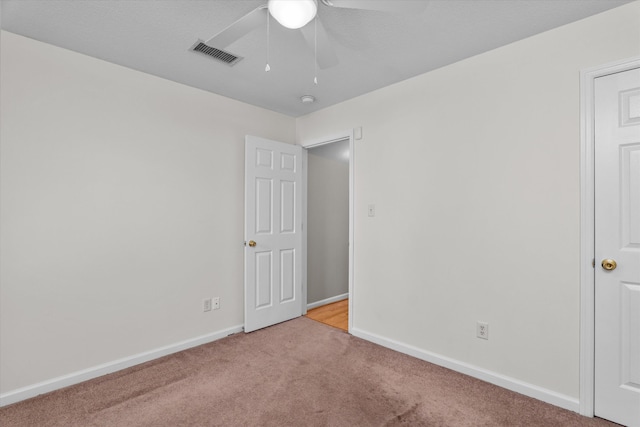2795 Davis Mill Rd, Hephzibah, GA 30815 - unfurnished bedroom with baseboards, a ceiling fan, carpet flooring, and visible vents
