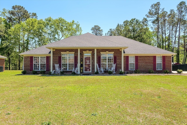 2795 Davis Mill Rd, Hephzibah, GA 30815 - ranch-style house featuring a front lawn, central AC, a porch, brick siding, and a shingled roof