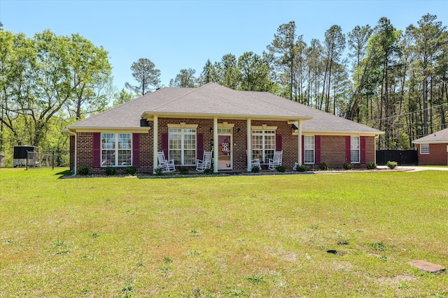 2795 Davis Mill Rd, Hephzibah, GA 30815 - ranch-style home featuring brick siding, covered porch, a front yard, and fence