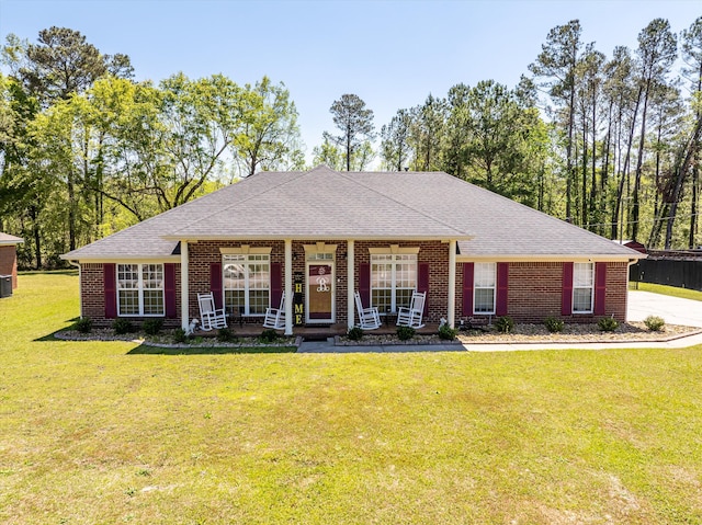2795 Davis Mill Rd, Hephzibah, GA 30815 - ranch-style home featuring brick siding, a porch, a front yard, and a shingled roof