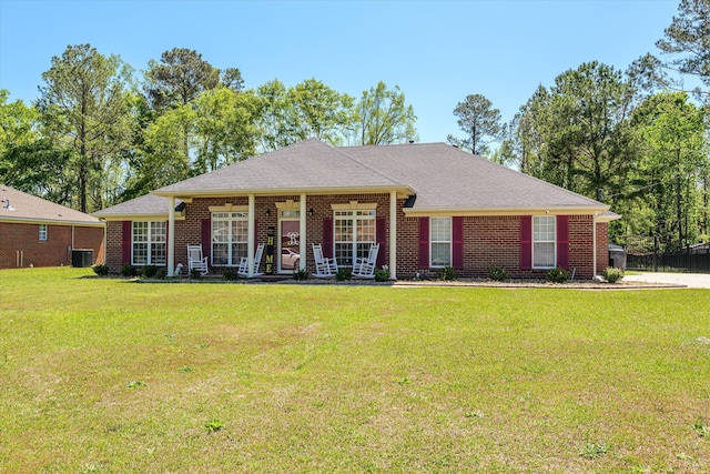 2795 Davis Mill Rd, Hephzibah, GA 30815 - ranch-style home featuring a front lawn, central air condition unit, covered porch, brick siding, and a shingled roof