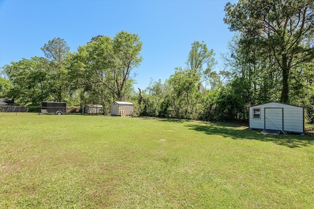 2795 Davis Mill Rd, Hephzibah, GA 30815 - view of yard featuring fence, an outbuilding, and a storage shed