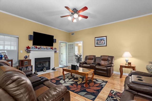 2795 Davis Mill Rd, Hephzibah, GA 30815 - living room featuring light wood-type flooring, a ceiling fan, visible vents, and ornamental molding