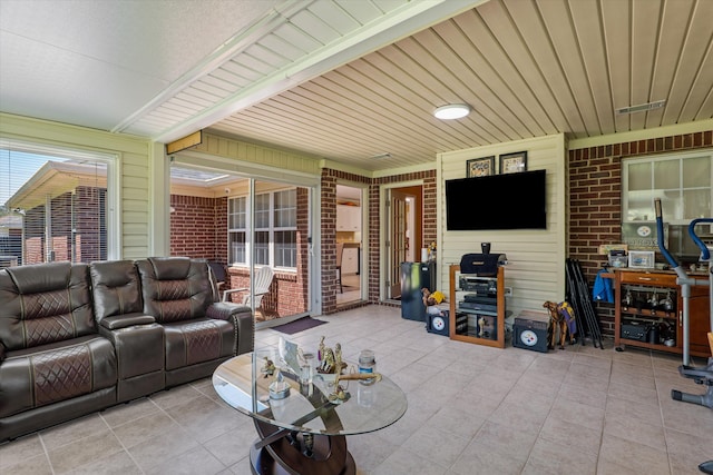 2795 Davis Mill Rd, Hephzibah, GA 30815 - living area with brick wall and tile patterned flooring