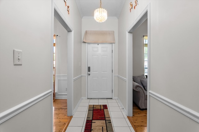 2795 Davis Mill Rd, Hephzibah, GA 30815 - doorway featuring light wood-style flooring, ornamental molding, and a notable chandelier