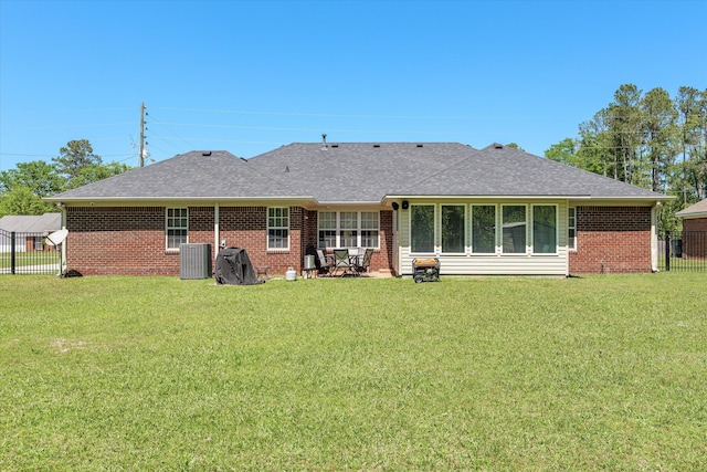 2795 Davis Mill Rd, Hephzibah, GA 30815 - back of house featuring brick siding, a lawn, a shingled roof, and fence