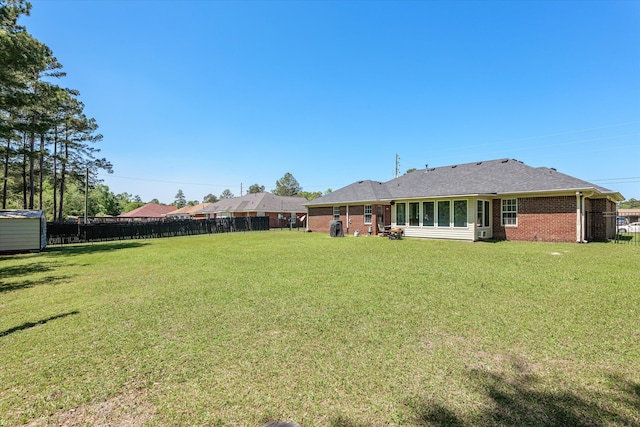 2795 Davis Mill Rd, Hephzibah, GA 30815 - view of yard featuring a fenced backyard, an outbuilding, and a storage unit