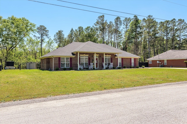 2795 Davis Mill Rd, Hephzibah, GA 30815 - single story home with brick siding, a storage unit, a front yard, and an outdoor structure