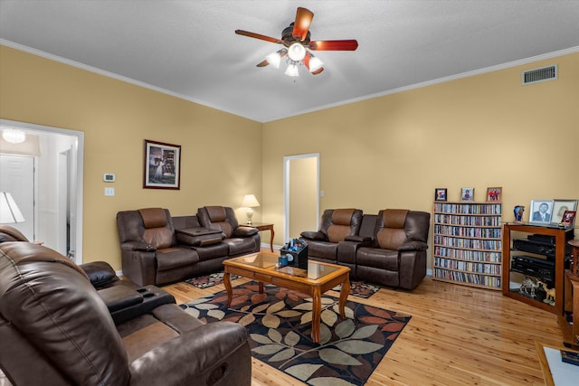 2795 Davis Mill Rd, Hephzibah, GA 30815 - living room with ceiling fan, crown molding, light wood finished floors, and visible vents