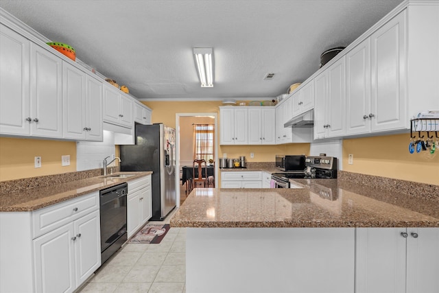 2795 Davis Mill Rd, Hephzibah, GA 30815 - kitchen with white cabinets, a peninsula, a sink, under cabinet range hood, and appliances with stainless steel finishes