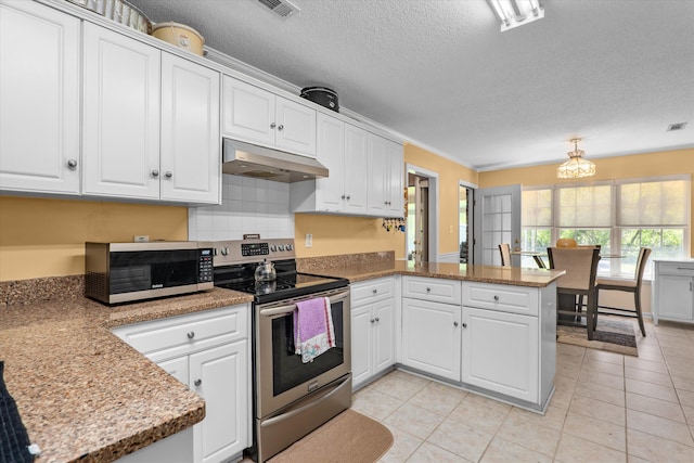 2795 Davis Mill Rd, Hephzibah, GA 30815 - kitchen with a textured ceiling, appliances with stainless steel finishes, white cabinets, a peninsula, and under cabinet range hood