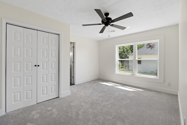 5 Elm St, Beech Island, SC 29841 - unfurnished bedroom featuring carpet, a closet, a textured ceiling, and a ceiling fan