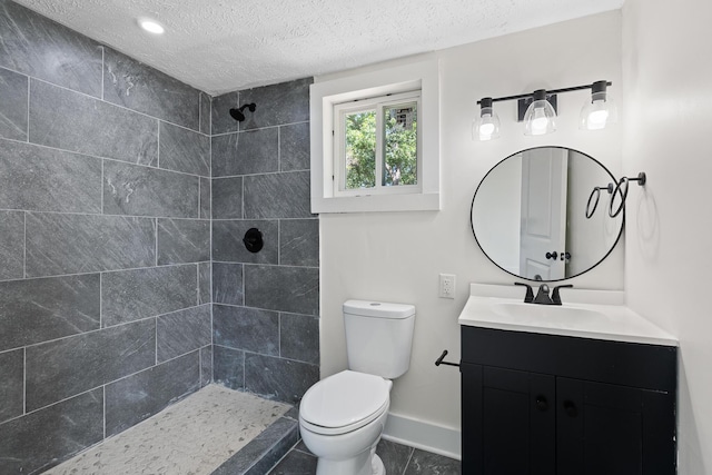 5 Elm St, Beech Island, SC 29841 - bathroom featuring a tile shower, a textured ceiling, and vanity