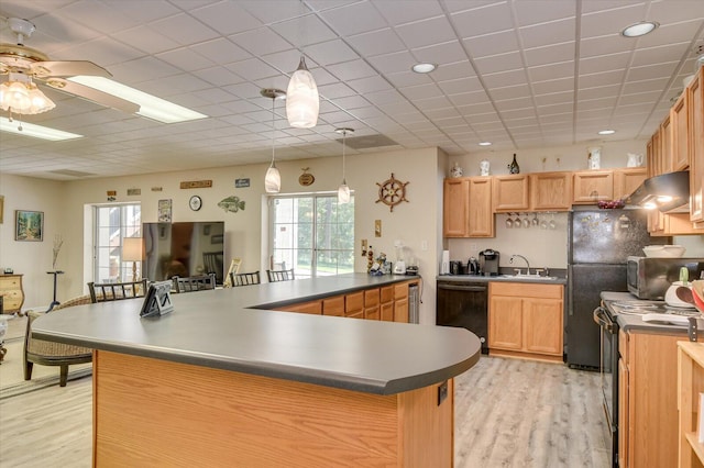 kitchen featuring ceiling fan, sink, black appliances, light hardwood / wood-style floors, and range hood