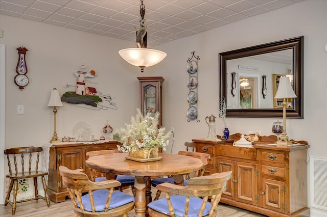 dining area featuring light wood-type flooring