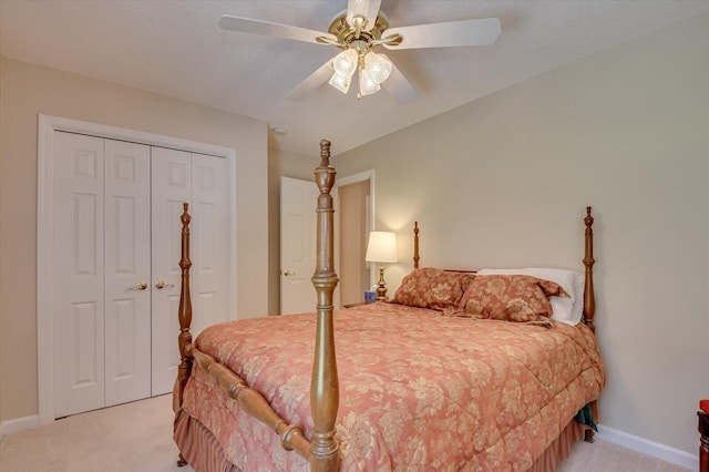 carpeted bedroom featuring ceiling fan and a closet