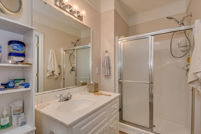 bathroom with vanity and a shower with shower door