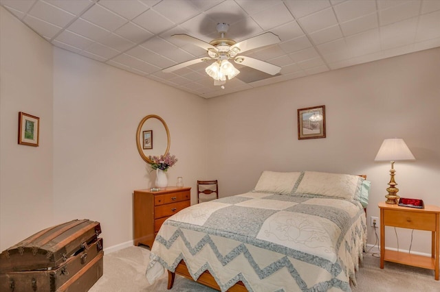 bedroom featuring ceiling fan and light carpet