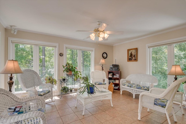 tiled living room with a healthy amount of sunlight and crown molding