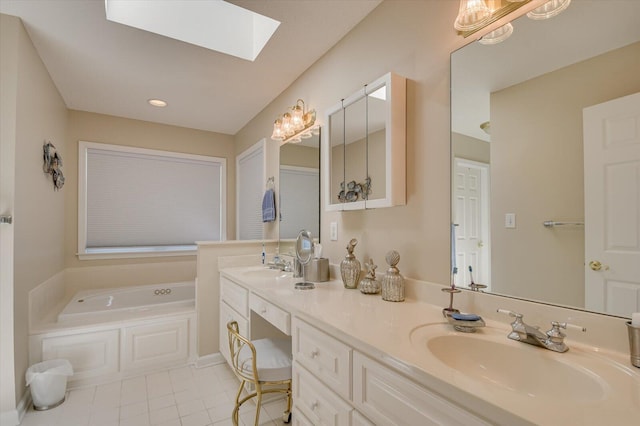 bathroom with tile patterned flooring, a tub to relax in, vanity, and a skylight