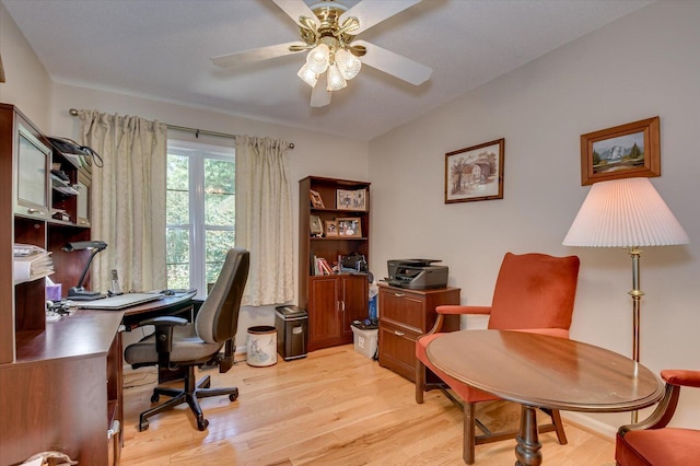 home office featuring ceiling fan and light hardwood / wood-style flooring