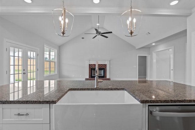 kitchen featuring french doors, sink, decorative light fixtures, dishwasher, and white cabinetry