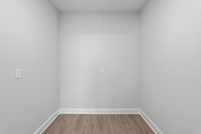 empty room with light hardwood / wood-style flooring