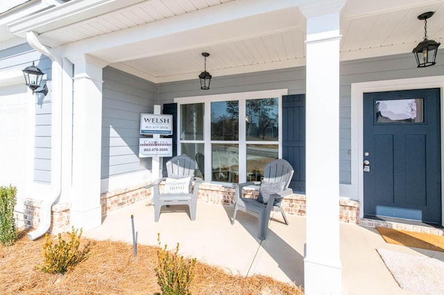 doorway to property featuring covered porch