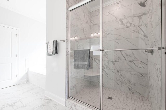 bathroom featuring ornamental molding and independent shower and bath