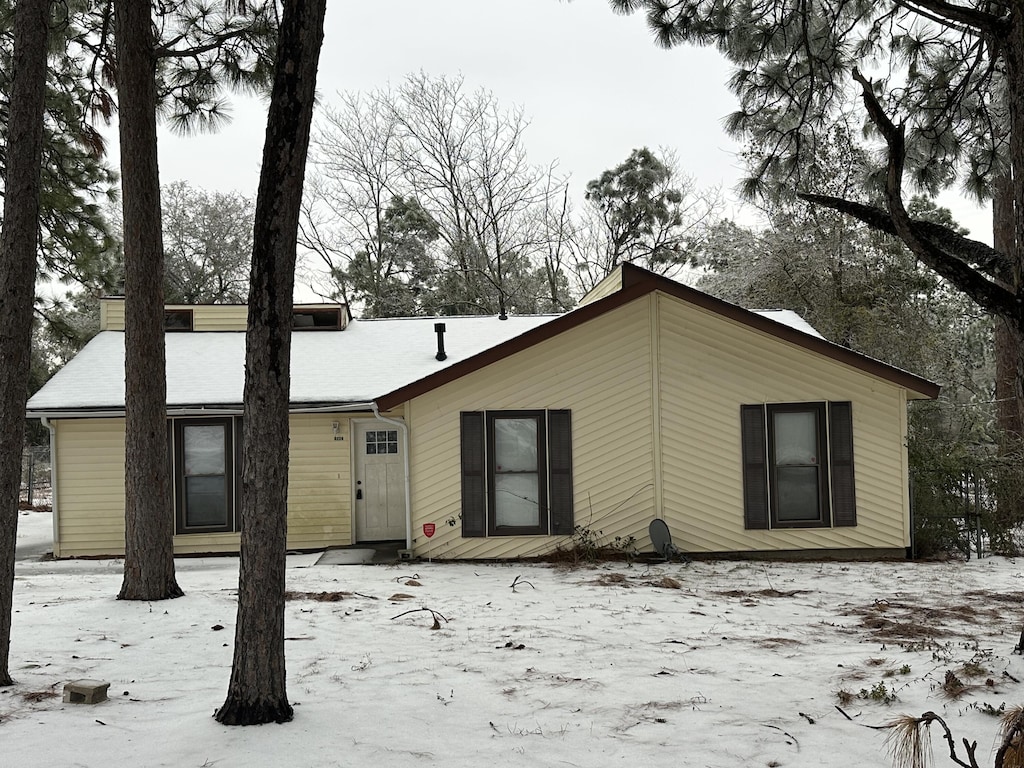 view of snow covered house