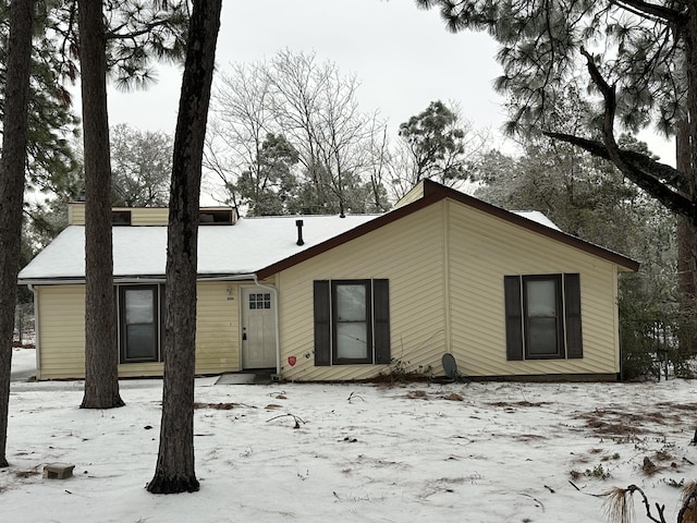 view of snow covered house