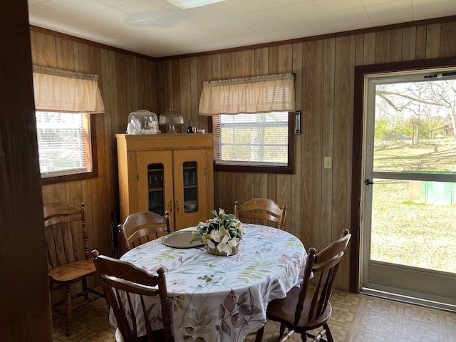 dining area with wooden walls