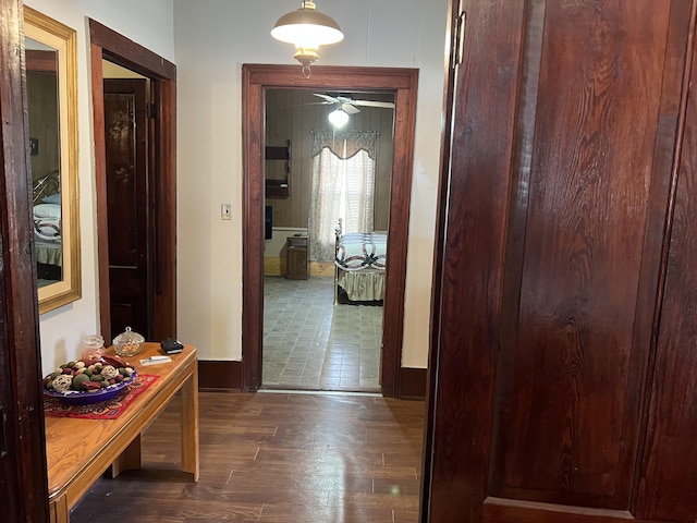 hallway with dark hardwood / wood-style floors