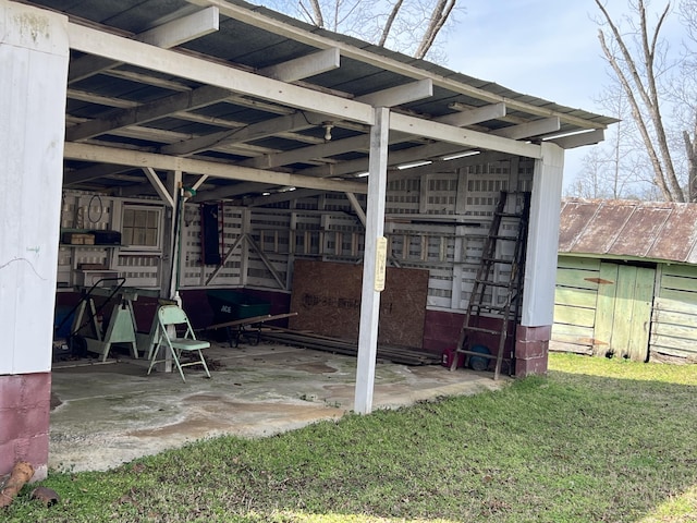 view of patio / terrace featuring an outbuilding