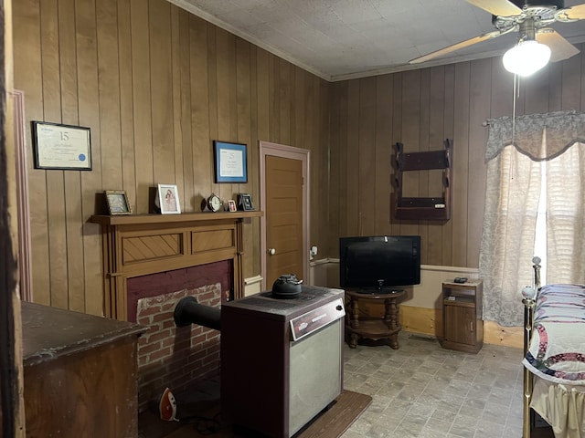 interior space with ceiling fan and wood walls